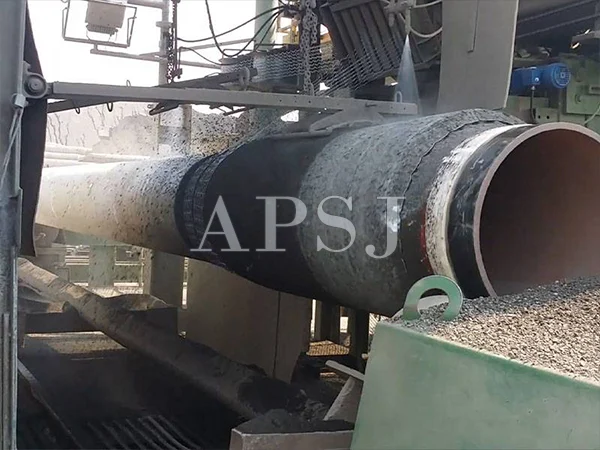 The machinery is winding the pipeline reinforced mesh around the pipeline.